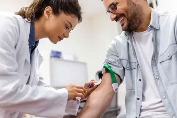 Phlebotomy-Technician-Beautiful-Young-Woman-Drawing-Blood-from-Male-Patient-1024x682-1